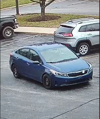 blue 4-door Kia with a temporary registration plate leaving a bank robbery in Belvidere, IL on Nov. 23, 2024
