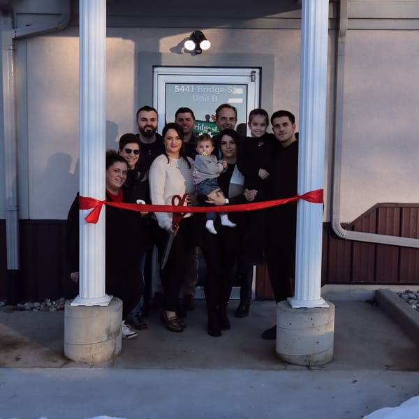 Bridge St. Pizza & Chicken Co. celebrates ribbon cutting in Roscoe