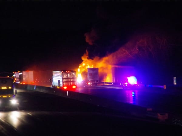 Firefighters battle a semi truck fire on I-90