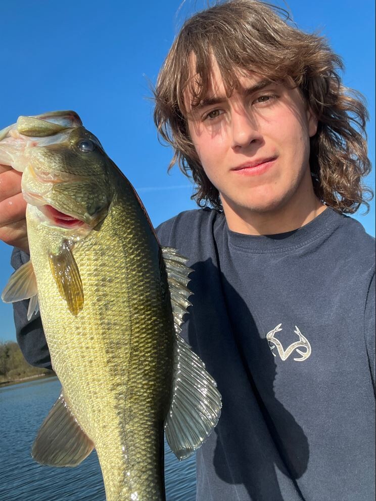 Dylan Austin showing off his latest Bass caught for the Hononegah Bass Fishing Team