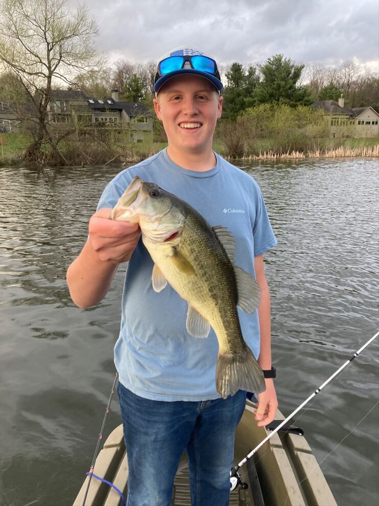 Kaden Holze beaming while showing off his latest bass caught for the Hononegah Bass Fishing Team