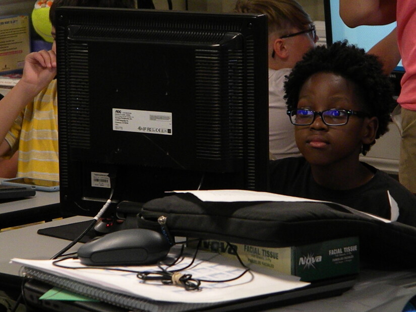 child coding on a computer