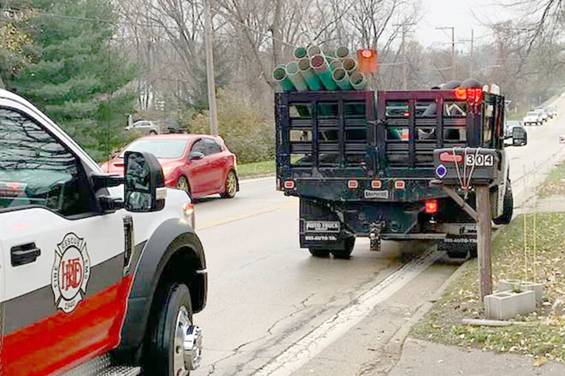 Pipe truck and fire truck after collision on Ralston Road, Winnebago County, IL