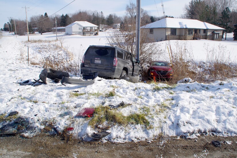 Two cars in a ditch on a snowy day