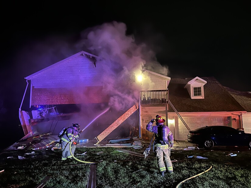 Smoke and steam as firefighters extinguish an nightime apartment fire