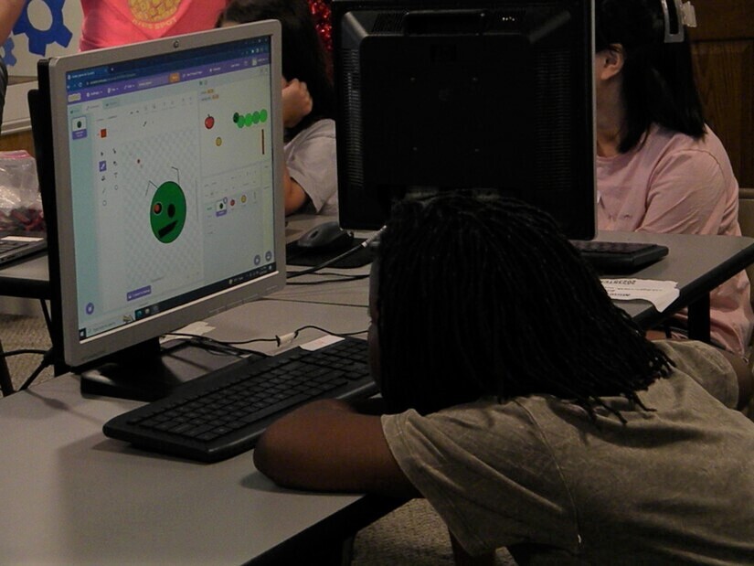 child coding on a computer