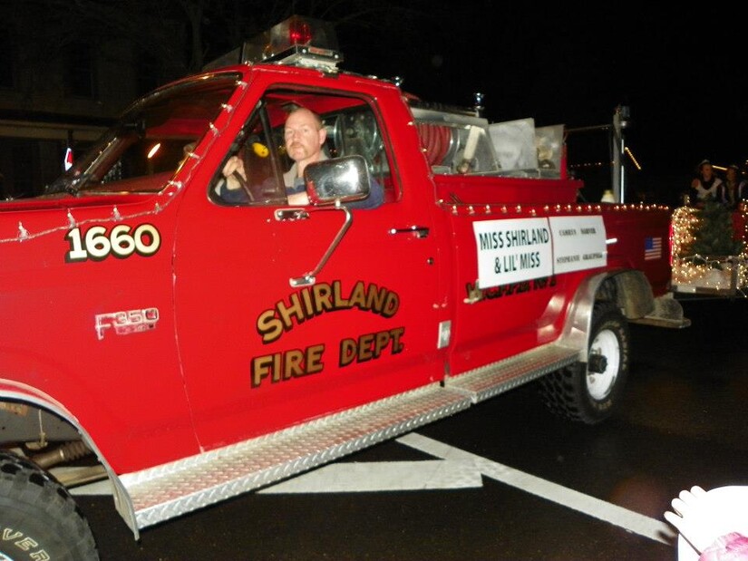 Shirland Fire Department truck in lighted Christmas parade